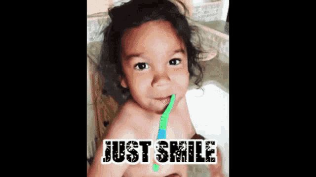 a little girl is brushing her teeth and the words just smile are above her