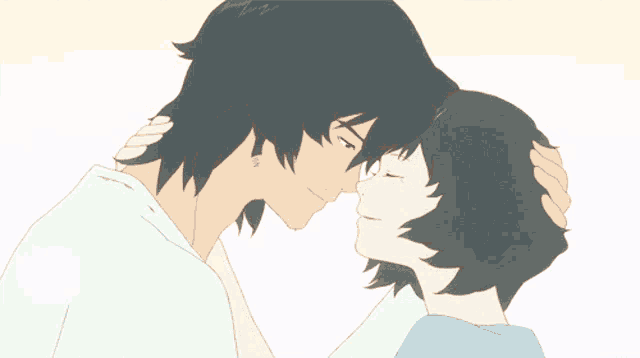 a man and a woman are touching their foreheads and looking at each other