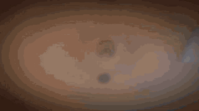 a computer generated image of a swirl with a light coming out of it