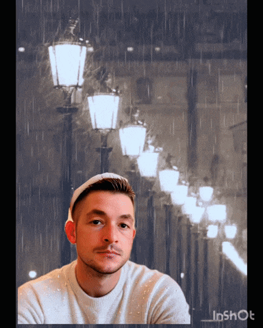 a man is standing in front of a row of street lights