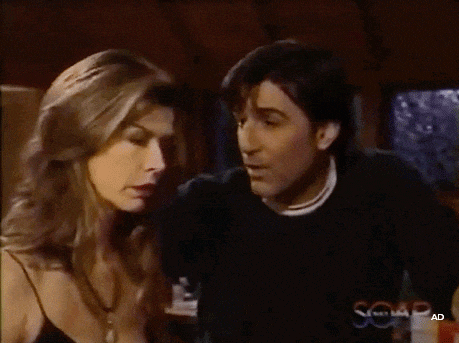 a man and a woman are looking at each other on a screen that says soap ad