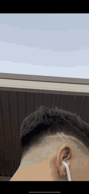 a close up of a man 's head with a shaved design