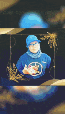 a woman wearing a blue shirt and a blue hat that says sport on it