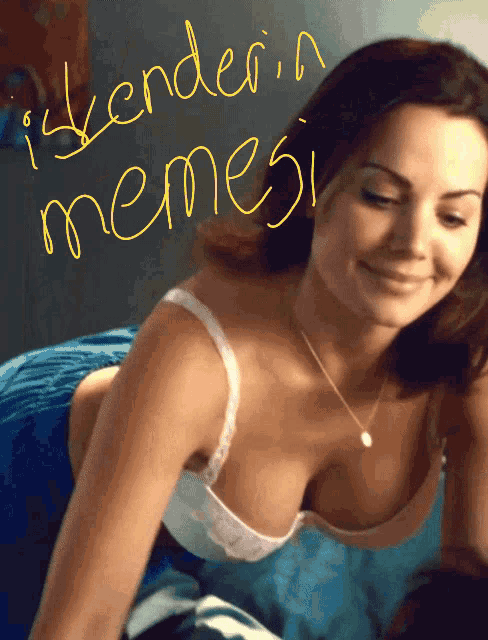 a woman in a bra is smiling with the words " iskenderin memesi " written on the bottom