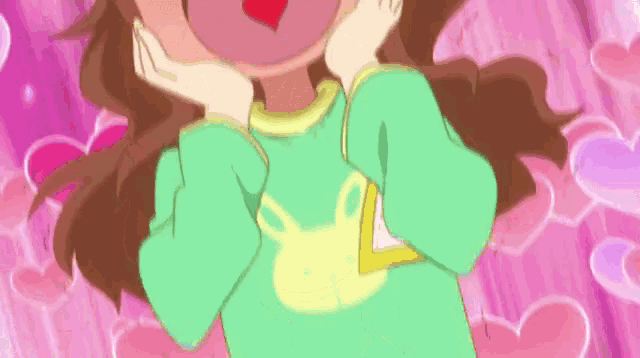 a girl wearing a green shirt with a yellow bunny on it