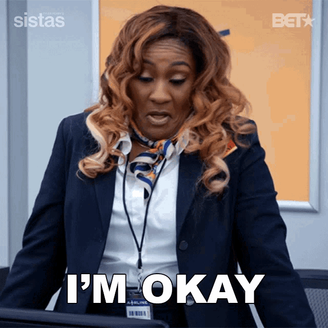 a woman in a suit says i 'm okay in white letters