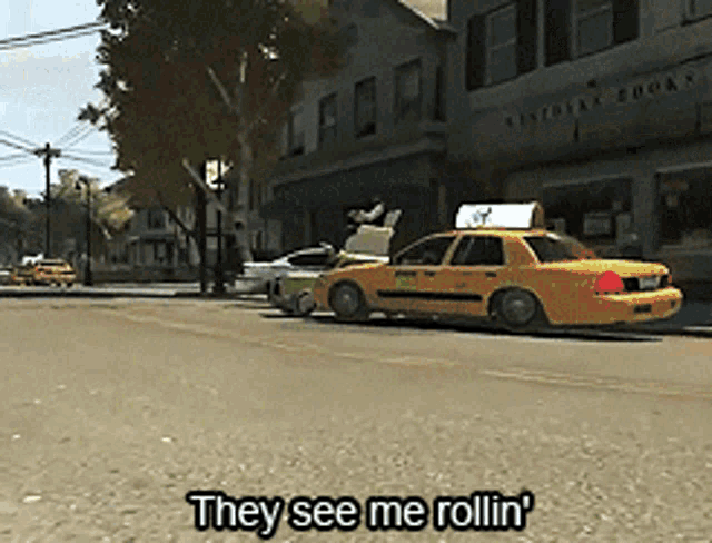 a yellow taxi cab is driving down a street with the words they see me rollin