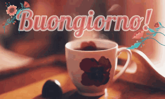 a cup of coffee is on a table with the words buongiorno