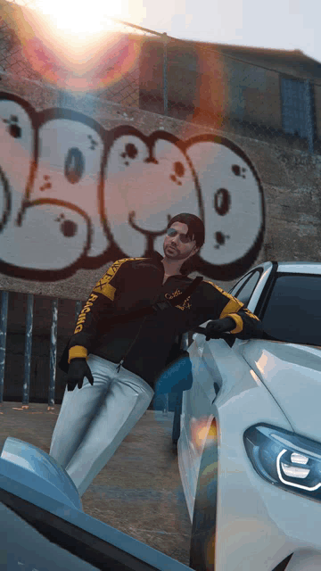 a man standing next to a white car with a graffiti wall in the background that says ' sbco '