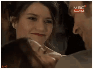 a man and a woman are looking at each other with the words mbc on the bottom