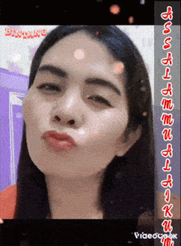 a close up of a woman 's face with the word bintang on the bottom right