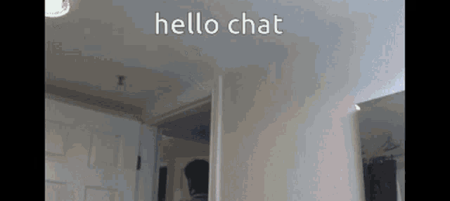 a room with a door open and the words hello chat written on the ceiling