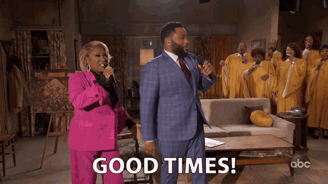 a man in a suit and a woman in a pink suit singing in front of a choir with the words good times on the bottom