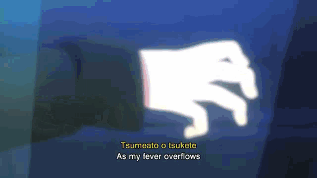a person 's hand is glowing in the dark and says tsumeato o tsukite