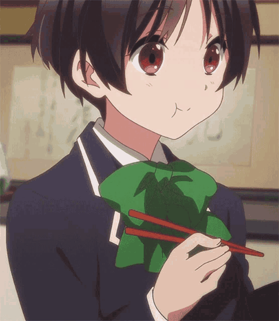 a girl with red eyes and a green bow tie holds chopsticks