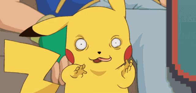 a pikachu with its tongue hanging out is being held in someone 's hand