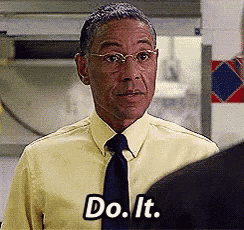 a man in a yellow shirt and tie says do it