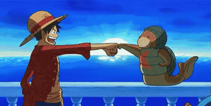 a man in a straw hat is giving a fist bump to a seal .