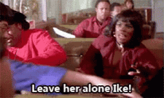 a group of people are sitting in a diner and one of them is saying leave her alone ike .