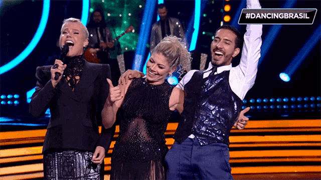 a group of people on a stage with the hashtag #dancingbrasil above them