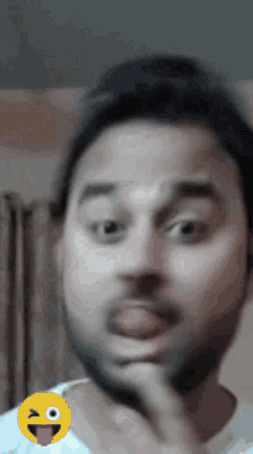 a man making a funny face with his tongue out
