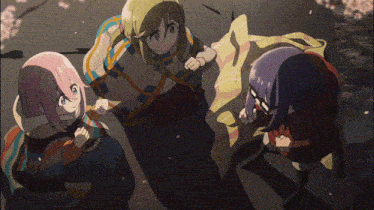 a group of anime characters are sitting on a blanket