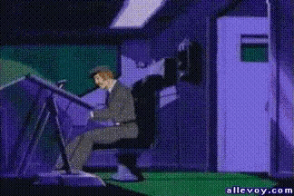 a cartoon of a man sitting at a desk next to a lizard with allevoy.com written on the bottom
