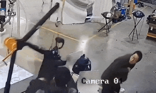 a man is standing in front of a camera that says camera 0 on it