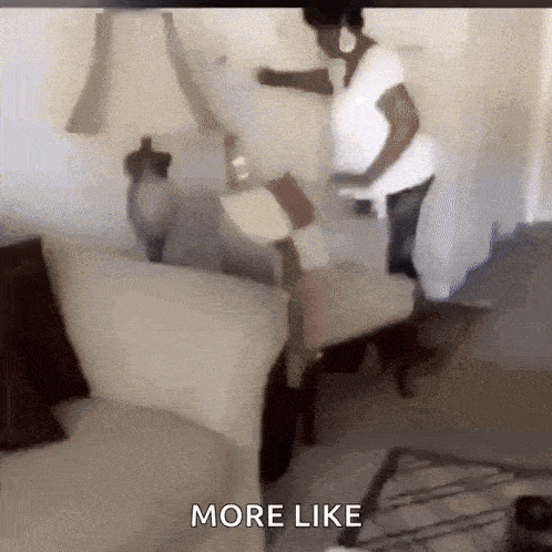 a woman is standing in a living room next to a couch and a lamp .