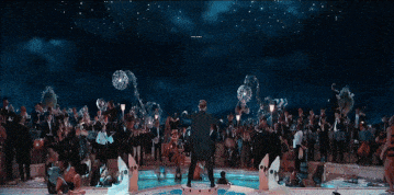 a group of people are dancing in front of a sign that says peelaries