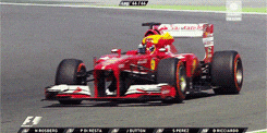 a ferrari race car is driving on a track