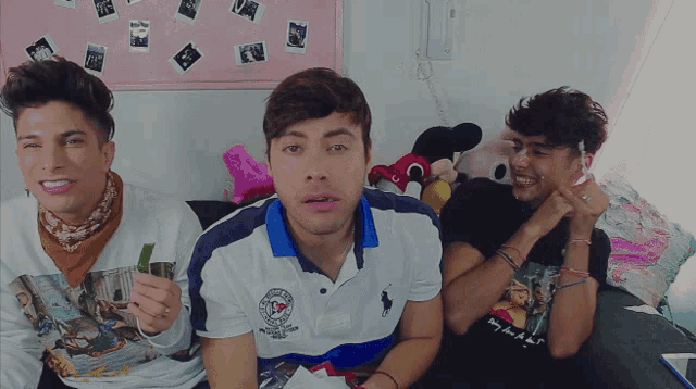 a man wearing a polo shirt that says ' ralph lauren ' on the front