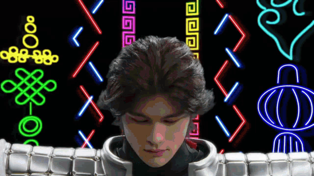 a man in a futuristic suit is surrounded by neon lights and symbols