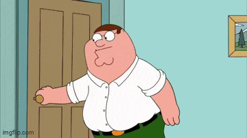 peter griffin from family guy is standing in a doorway