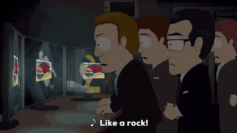 a group of men are looking at a computer screen with the words like a rock