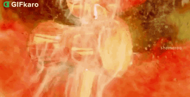 a close up of a person standing in a room with a lot of fire coming out of it .