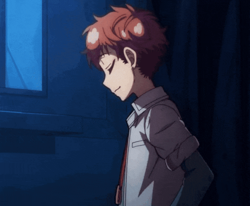 a boy with red hair and a white shirt is standing in front of a window