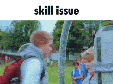 a man standing next to a hose that says skill issue on it