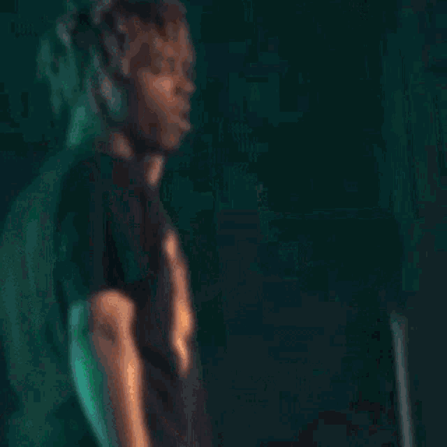 a man wearing a black t-shirt with the word juicewrld on it