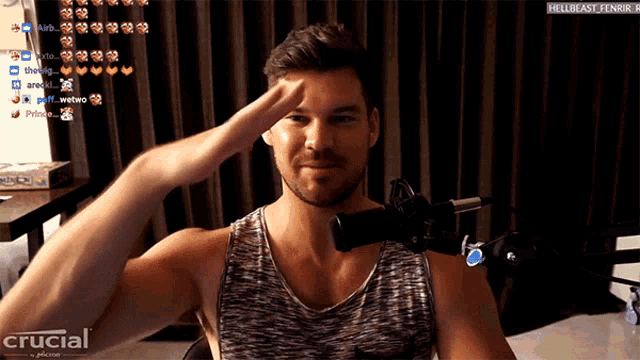a man salutes in front of a crucial advertisement