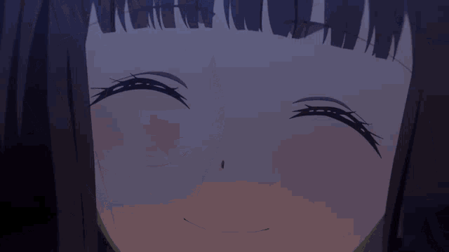 a close up of a woman 's face with a smile on her face