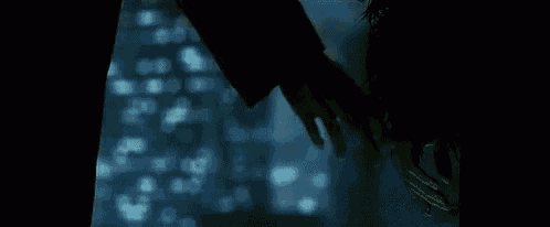 a close up of a person 's hand holding a piece of ice .