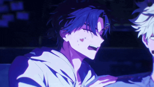 a boy with blue hair is talking to another boy in a dark room