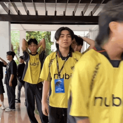 a group of boys wearing yellow shirts with the word ubi on them