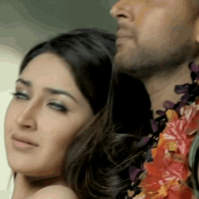 a close up of a man and woman 's faces