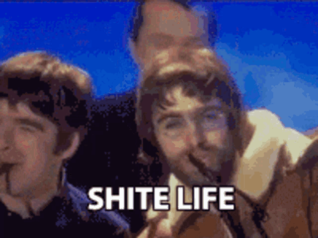 a group of men standing next to each other with the words " shite life " in white letters