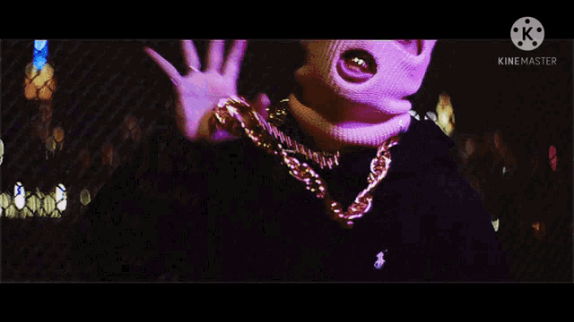a person wearing a ski mask with the word froggy on the bottom