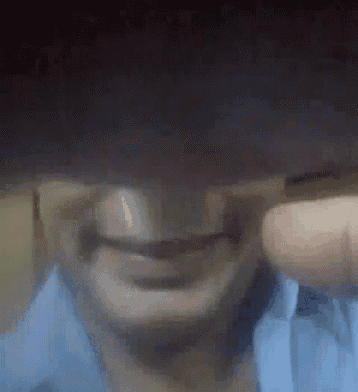 a close up of a man 's face with a blurred background