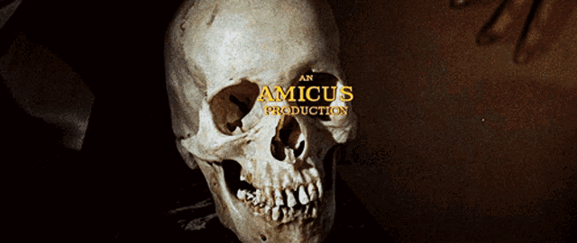 a close up of a skull with an amicus production logo