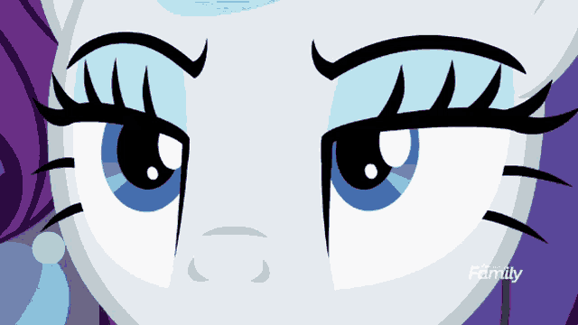 a close up of a cartoon character 's eyes with the words family visible
